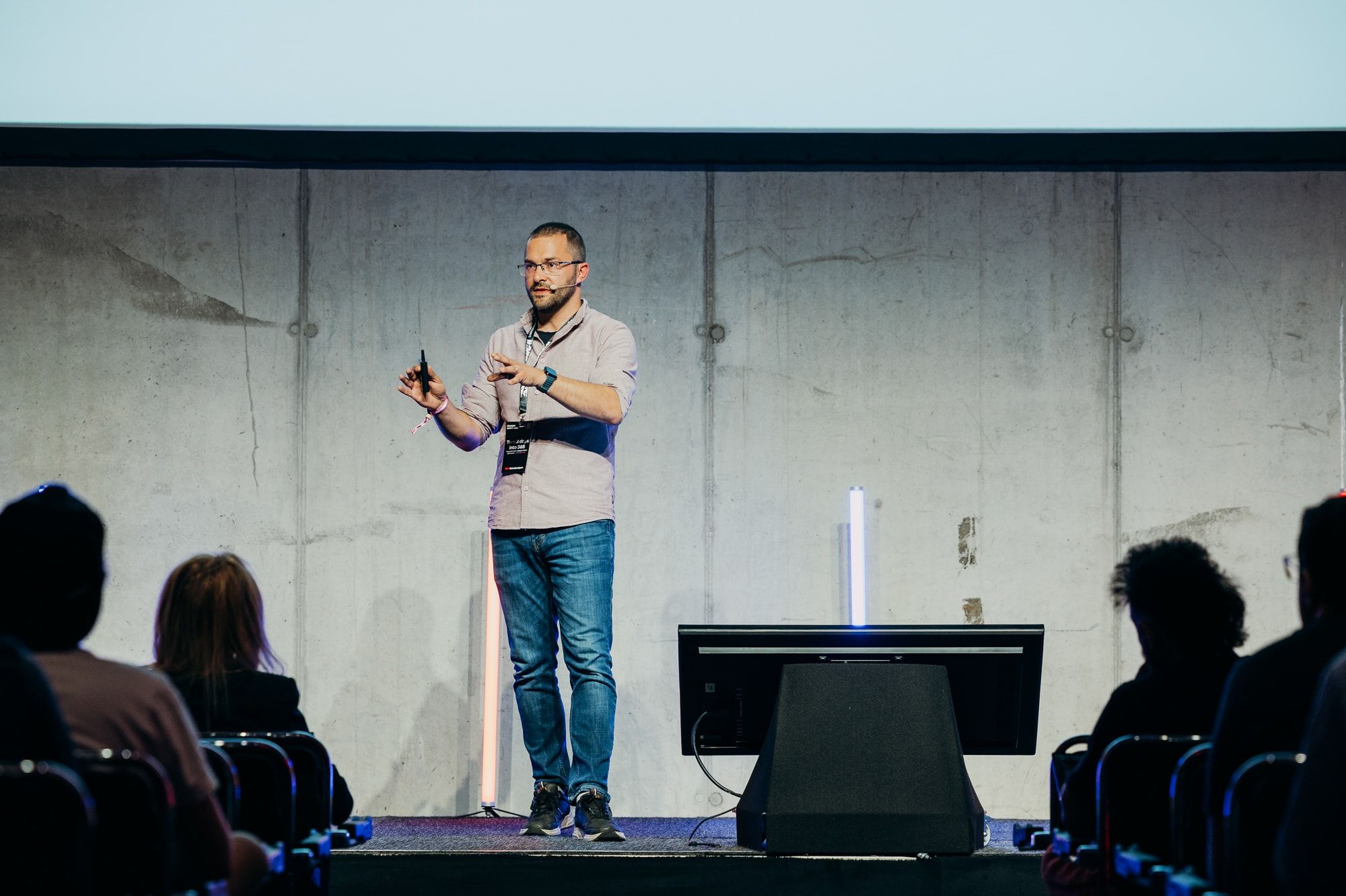 Full-length view of Sasa Fajkovic presenting on stage at WeAreDevelopers World Congress 2026, seen past the audience